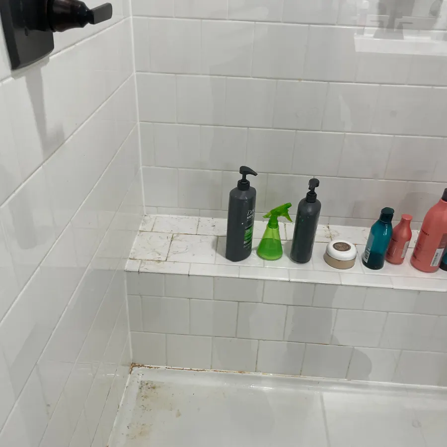 a tiled walk-in shower, before a Brio Cleaning visit